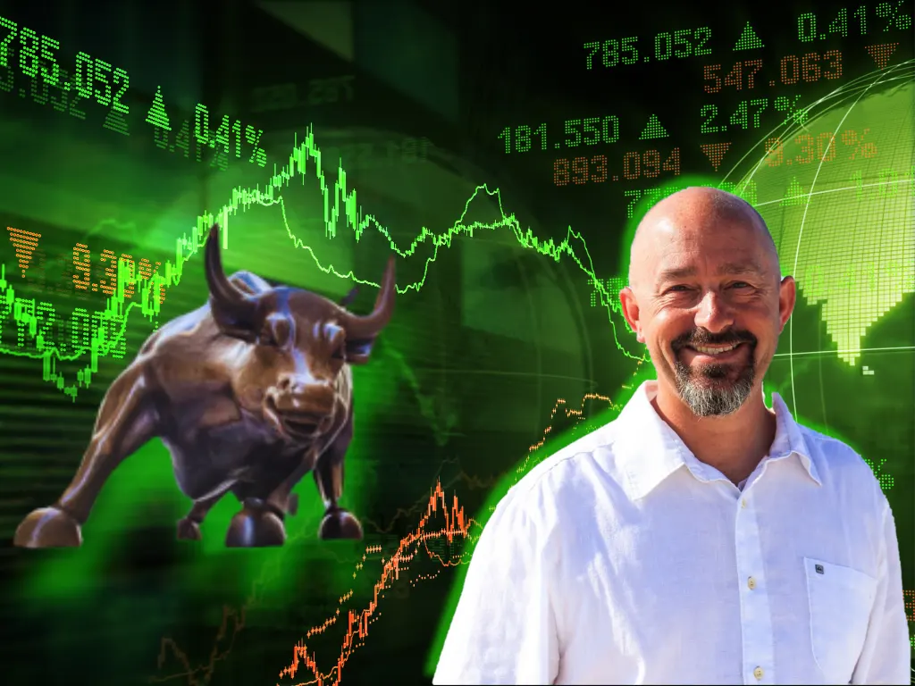 Trent Grinkmeyer in front of stock market with bull background